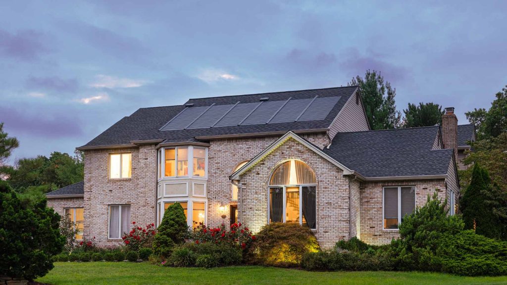 A residential home with solar shingles installed.